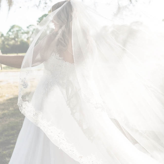 Model wearing a white gown