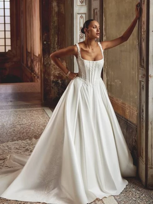 Model wearing a gown by Justin Alexander