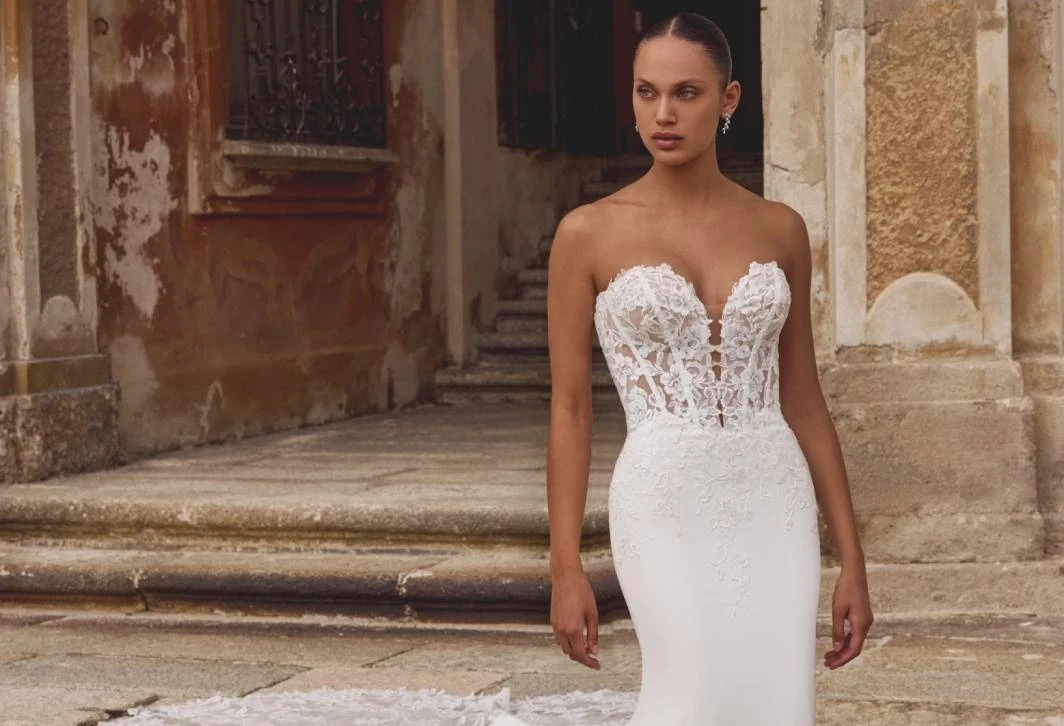 Model wearing a gown by Justin Alexander