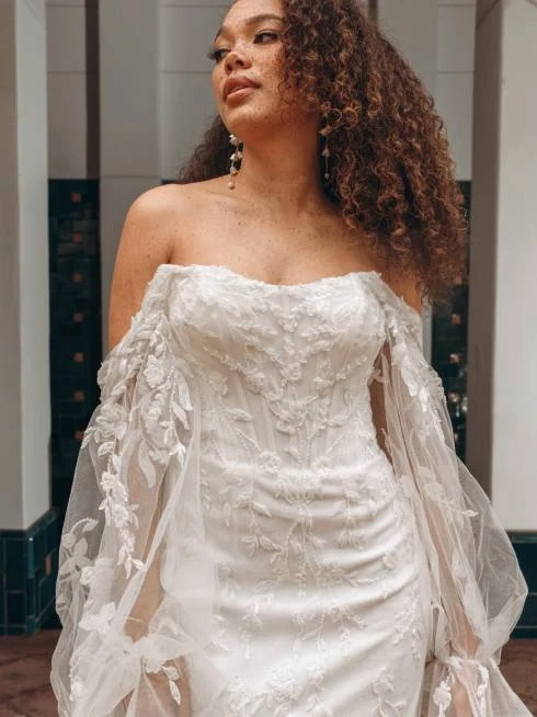 Model wearing a gown by Stella York