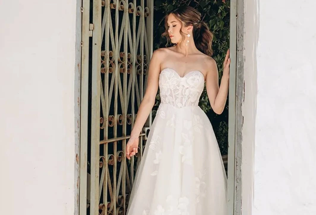 Model wearing a gown by Stella York